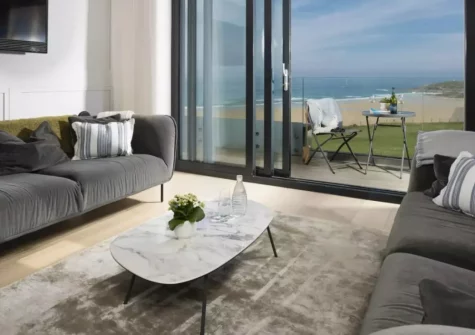 Number 9 Fistral House, Newquay is a luxurious three-bedroom penthouse, located just fifty metres from Fistral Beach. It has a private balcony, and offers stunning views over the ocean. It is styled with premium coastal interiors throughout.