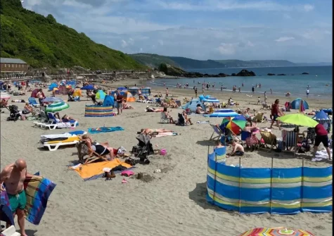 Lively East Looe Beach's waves and shallow waters make it an ideal spot for safe swimming