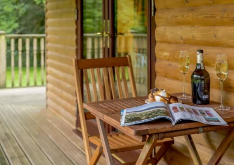 The decked balcony & outdoor sitting area at Oak at Waldon Valley Lodges, Bradworthy