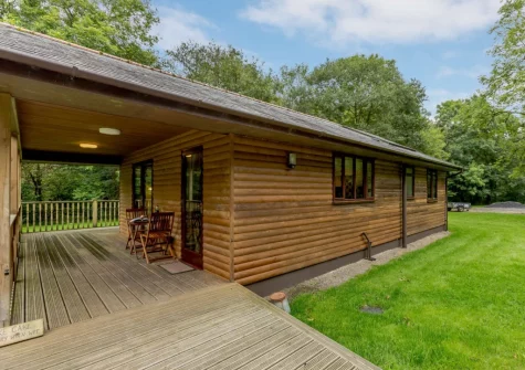 The decked balcony & lawned garden at Oak at Waldon Valley Lodges, Bradworthy