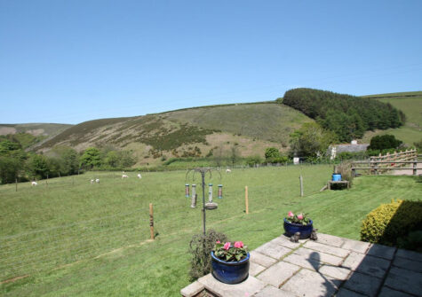 The garden & countryside view at Oare Water Cottage, Oare