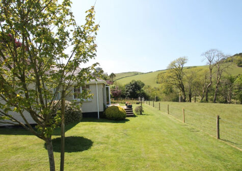 The garden & countryside view at Oare Water Cottage, Oare