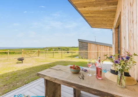 The terrace, barbecue, alfresco dining area & enclosed garden at Ocean at The Views, Morwenstow