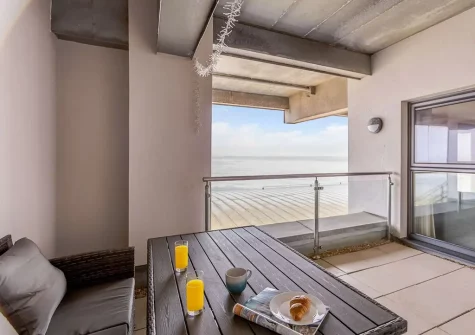 The patio balcony & outdoor sitting area at Ocean Bay, Westward Ho!