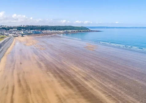Two miles of sandy beach is right on your doorstep as well as an array of cafes, shops & restaurants