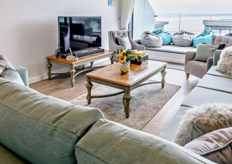 Ocean Charm, Westward Ho! is a luxurious five-bedroom coastal retreat featuring extraordinary sea views across to Lundy Island, private hot tub, cinema room, and offering direct beach access. Perfect for creating unforgettable family holidays.