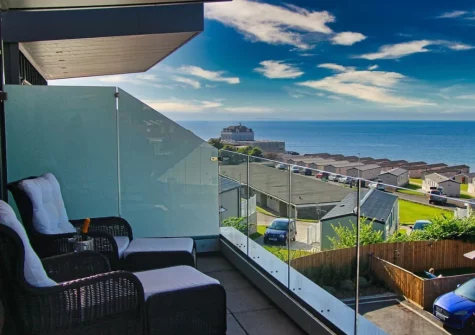 The balcony & outdoor sitting area at Ocean Escape, Westward Ho!