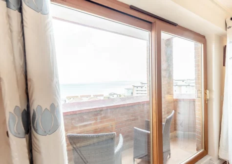 The balcony & outdoor sitting area at Ocean Park 16, Westward Ho!
