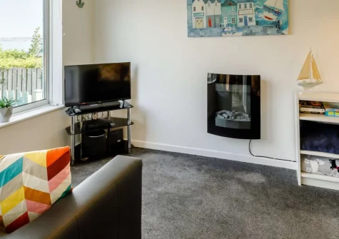 Ocean View at Brixham Holiday Park is a beautifully presented chalet with stunning Torbay sea views, featuring a sun-trap terrace, contemporary coastal interiors, indoor heated pool access, and Fishcombe Cove beach just moments away.