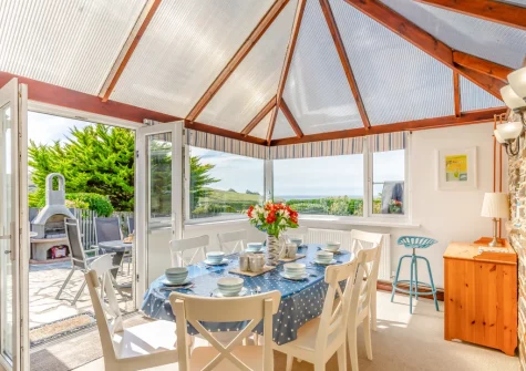 The conservatory dining area at Ocean View, Holywell