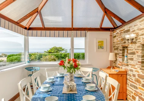 The conservatory dining area at Ocean View, Holywell
