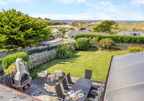 The patio, barbecue, alfresco dining area & enclosed lawned garden at Ocean View, Holywell