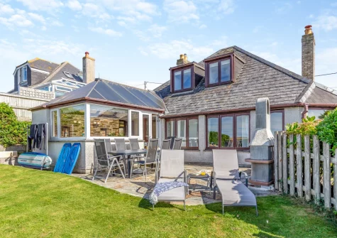 The patio, barbecue, alfresco dining area & enclosed lawned garden at Ocean View, Holywell