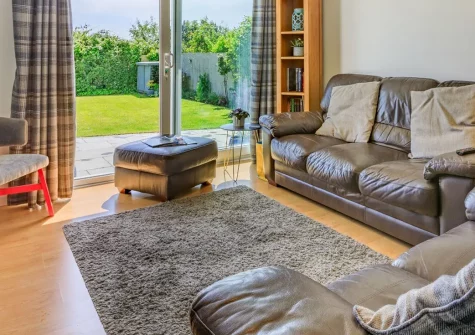 Oceans 10, Braunton is a beautifully renovated detached holiday home with three bedrooms, a private garden featuring a hot tub and fire pit, and just minutes from golden beaches. Perfect for families and friends seeking a luxurious coastal break.