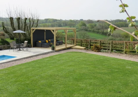 The shared plung pool, outdoor sitting area & garden at Ochre, West Putford