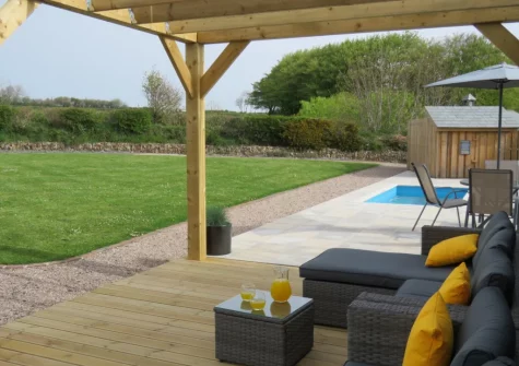 The shared plung pool, outdoor sitting area & garden at Ochre, West Putford