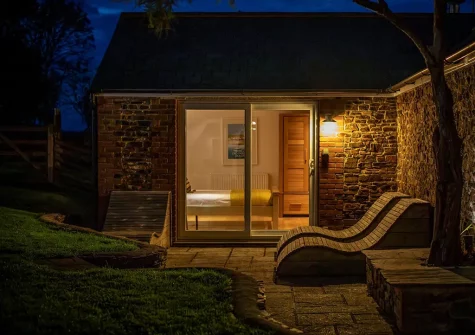 The annexe patio & outdoor sitting area at Old Farmhouse, Week Orchard