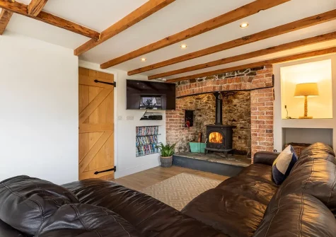 The games room sitting area at Old Farmhouse, Week Orchard
