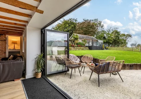 The games room & outdoor sitting area at Old Farmhouse, Week Orchard
