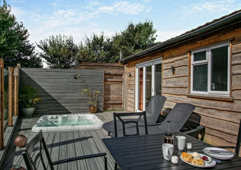 The enclosed decked terrace, alfresco dining area & hot tubd terrace & alfresco dining area at Old Spot, Westward Ho!