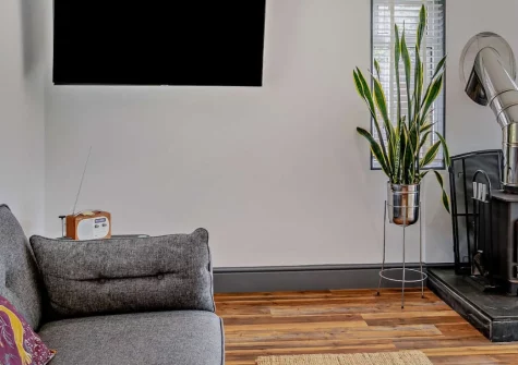 Old Spot, Westward Ho! is a distinctive cedar lodge set in peaceful grounds, featuring a private sunken hot tub, enclosed terrace with countryside views, cosy wood burner, and easy access to North Devon's stunning two-mile sandy beach.