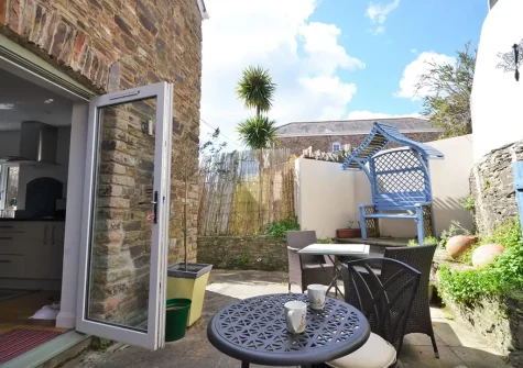 The courtyard & outdoor sitting area at Olive Court Coach House, Newton Ferrers