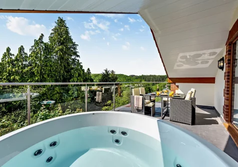 The hot tub & alfresco dining area at Olive Lodge, High Bickington