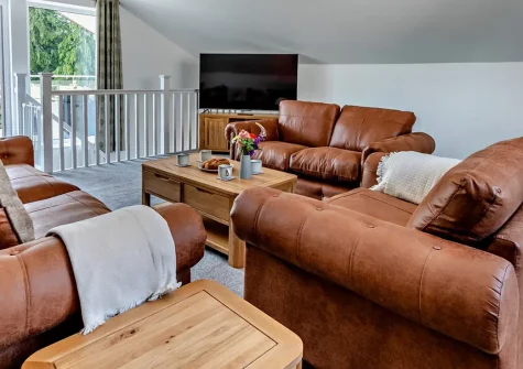 Olive Lodge, High Bickington is a stylish contemporary retreat featuring a hot tub, access to a shared pool, and great country views. With two comfortable bedrooms & upside-down living, it's perfect for families & couples seeking Devon adventures.