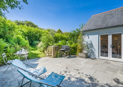 The patio, barbecue & outdoor sitting area at Olive Tree, St Teath