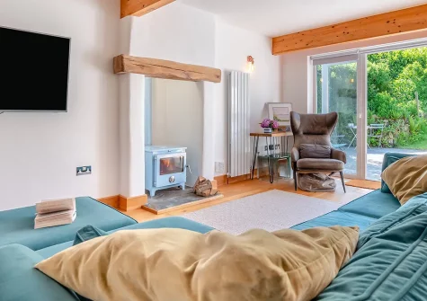 Olive Tree, St Teath is a luxurious single-storey cottage for six guests, featuring a bespoke kitchen, cocktail bar, and enclosed patio with BBQ. Perfectly positioned to explore Cornwall's dramatic coastline and legendary attractions.