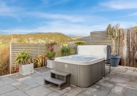 The patio & hot tub & outdoor sitting area at Omega, Freathy