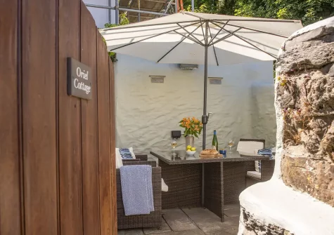 The courtyard, barbecue & alfresco dining area at Oriel Cottage, St Agnes