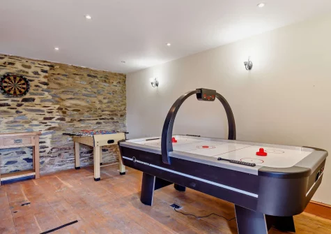 The shared games room at Otter Barn Lakes, St Giles-on-the-Heath