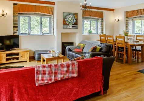 Otter Barn Lakes, St Giles-on-the-Heath is a charming barn conversion on the Devon-Cornwall border offering seven acres of private grounds, a luxurious hot tub, and lake-side relaxation. Perfect for families seeking countryside escape.