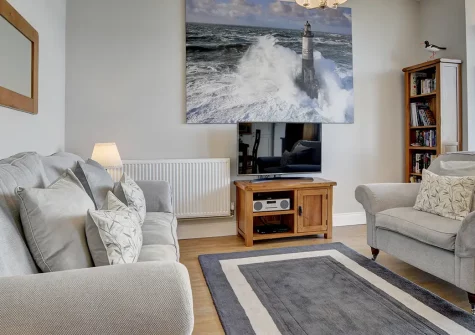 Oystercatchers, Ilfracombe is a stylish two-bedroom seafront apartment with stunning ocean views from floor-to-ceiling windows. Enjoy a private balcony, contemporary interiors, and easy access to harbour attractions and coastal adventures.