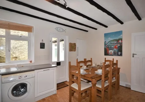 The kitchen & dining area at Palm Cottage, Brixham