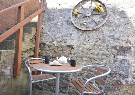 The garden & outdoor sitting area at Palm Cottage, Brixham