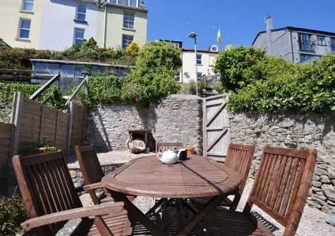 The garden terrace & alfresco dining area at Palm Cottage, Brixham
