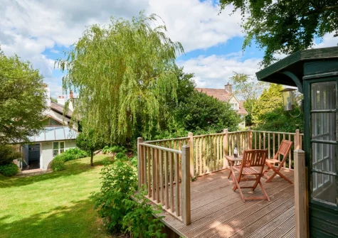 The garden, decked patio & summer house at Palmers Cottage, Dalwood