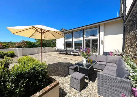 The south-facing patio, alfresco dining & outdoor sitting area at Park Gate Stables, Tawstock