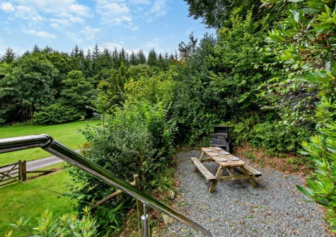 The alfresco dining area & enclosed garden at Parr Cottage, Two Waters Foot