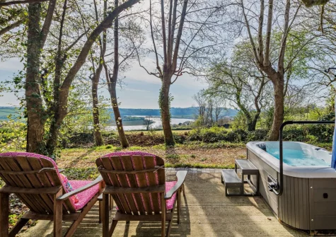 The secluded hot tub & sun loungers at Peace Cottage, Riverview, Bere Alston