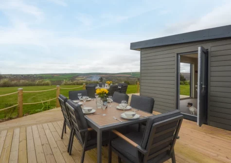 The decked patio & alfresco dining area at Peacehay Barn, Little Petherick