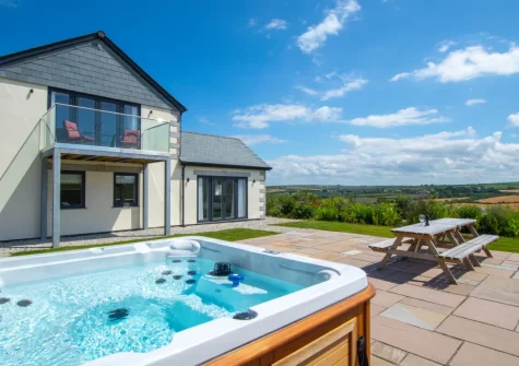 The patio, hot tub & alfresco dining area at Peacehay Barn, Little Petherick
