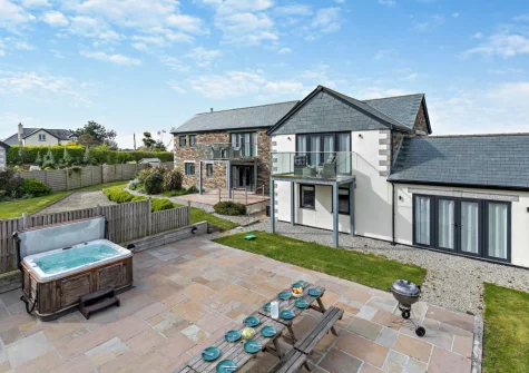 The patio, alfresco dining area & hot tub at Peacehay Barn, Little Petherick
