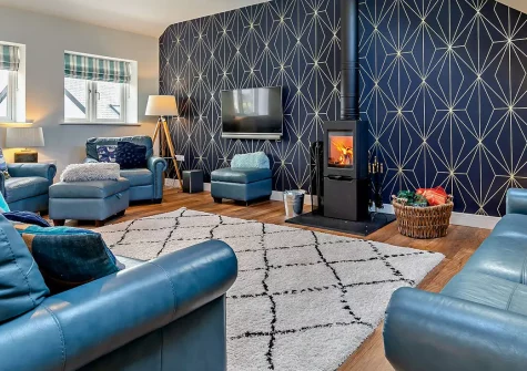 Peacehay Barn, Little Petherick is a stunning six-bedroom family retreat set in a sprawling acre of grounds. Enjoy a luxurious hot tub, countryside views from three balconies, and easy access to North Cornwall's finest beaches and attractions.