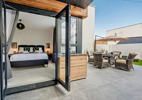 Bedroom #1 has French doors opening into the enclosed patio & garden