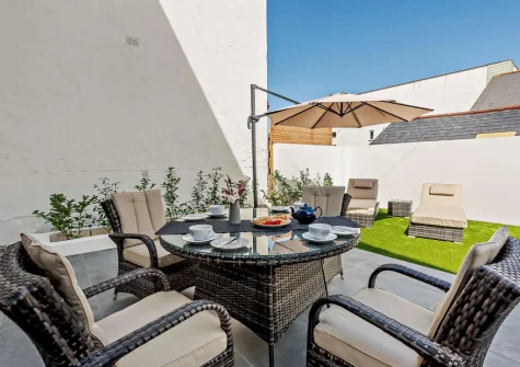 The patio, alfresco dining area & garden at Pebble Bay, Westward Ho!