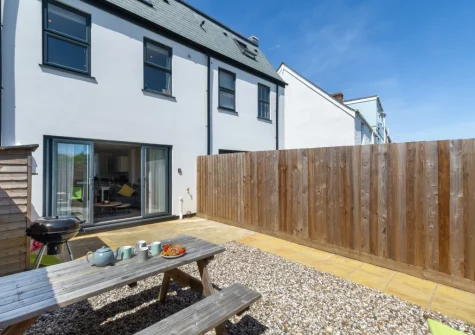 The paved patio garden, barbecue & alfresco dining area at Pebble House, Newquay