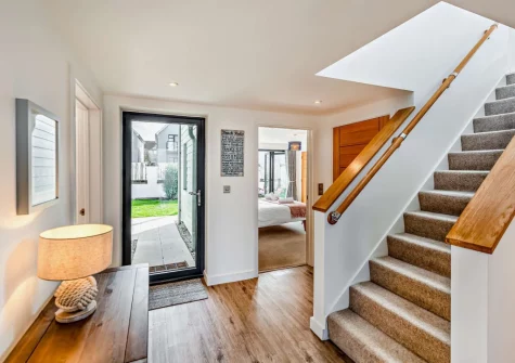 The entrance hallway & stairs up to the first floor at Pebble Links, Westward Ho!